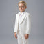 A young boy modeling a white formal kids' suit consisting of a jacket, vest, trousers, white shirt, and a matching bow tie, set against a solid gray studio background.