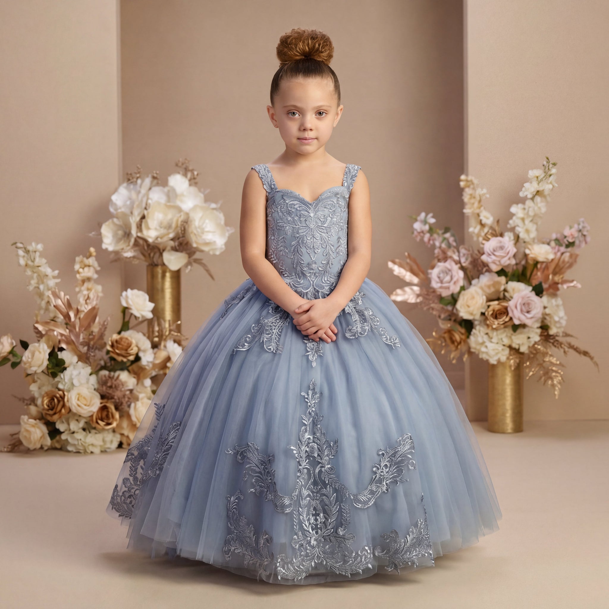 A girl wearing an elegant powder blue dress with intricate embroidery in a dusty pink background