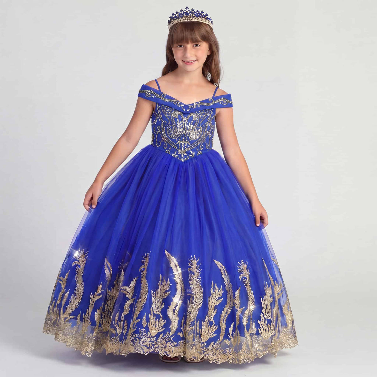 Elegant royal blue girls princess dress featuring sparkling rhinestones, gold embroidery, full tulle skirt, and adjustable corset back. Sizes 2-16 available. Main image